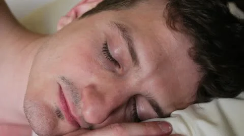 Man sleeping wakes up Stock Footage 10900854