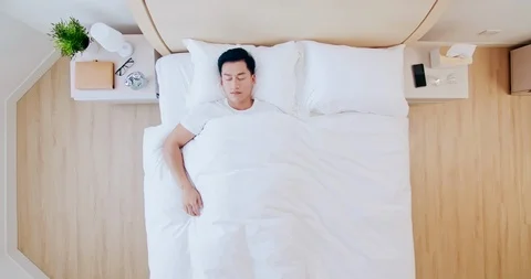 Man sleeping well in bed Stock Footage 121943362