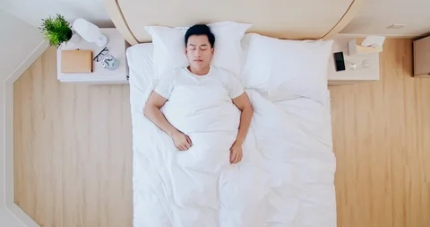 Man sleeping well in bed Stock Footage 123350506