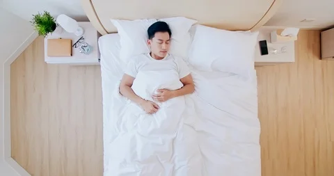 Man sleeping well in bed Stock Footage 123351013