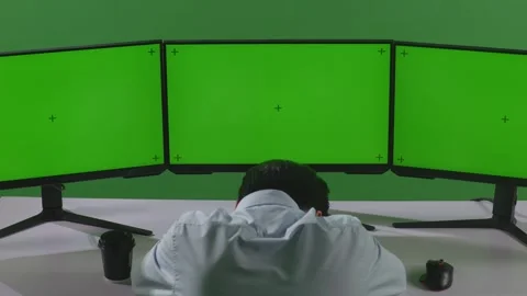 Man Sleeping While Working With Mock Up Multiple Computer Monitor In Green Stock Footage 249634137