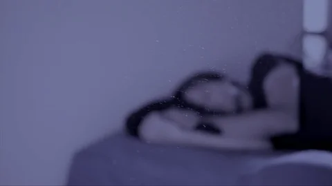 Man Sleeps in a Dusty Room Stock Footage