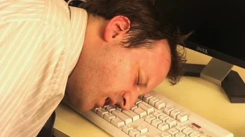 Man sleeps on  keyboard in office Video stock 21369766