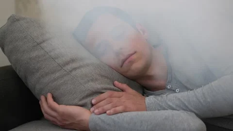 A man sleeps while a fire starts Stock Footage 156840472