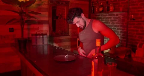 Man with sleeveless shirt take cocain on a bar Stock Footage
