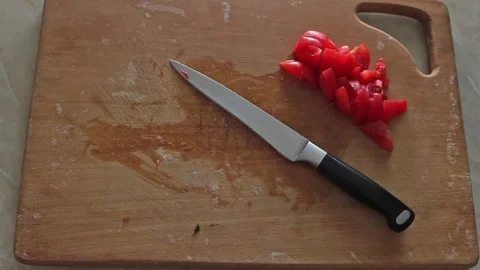 Man slices a cucumber Stock Footage 77589799
