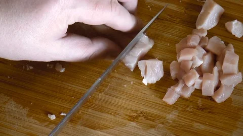 Man slices meat Stock Footage 78662234