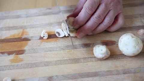 Man slices mushroom Stock Footage 76089260