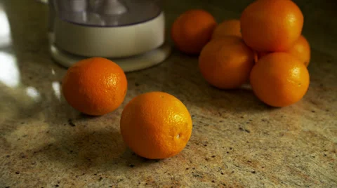 Man Slices Orange on Counter Stock Footage 35224655