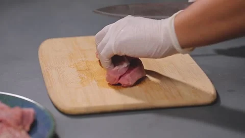 A man slicing beef meat  Stock Footage 155803074