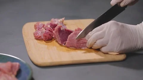 A man slicing beef meat  Stock Footage 155803529