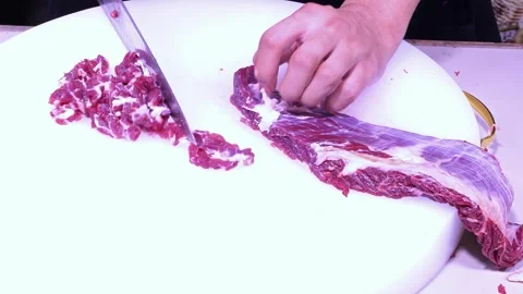 Man slicing the beef thinly Stock Footage 261272072