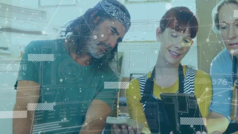 Man slicing bread and sharing phone screen with three colleagues, animating Stock Footage 312828938