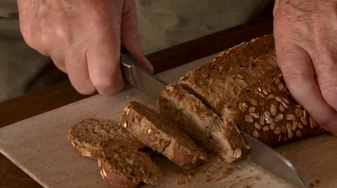 Man slicing bread Stock-Footage 43740254