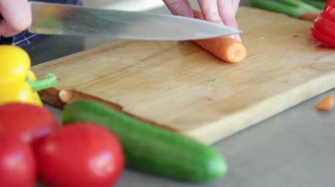 Man slicing carrot Stock Footage 40986971
