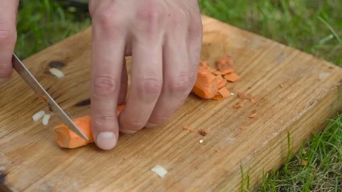 Man slicing carrots Stock Footage 80234908