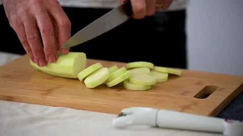 Man Slicing Courgette Stock Footage 183591952