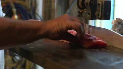 Man slicing fish in the workshop Stock Footage 83180049