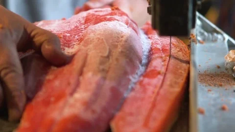 Man slicing frozen fish in the workshop Stock Footage 83180980