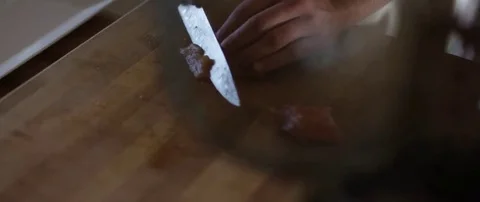 Man slicing meat and keeping it on the plate Stock Footage 69200826