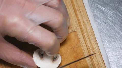 A man is slicing mushrooms. Stock Footage 83527609
