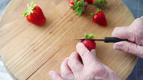 Man slicing strawberry Stock Footage 76090753