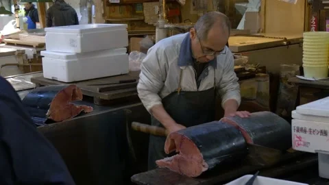 Man Slicing Tuna Inside The Biggest Fish Market In Tokyo, Japan Stock Footage 158993564