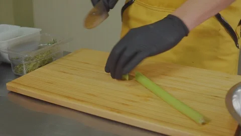 Man slicing vegetables at home kitchen. Stock Footage 103998463