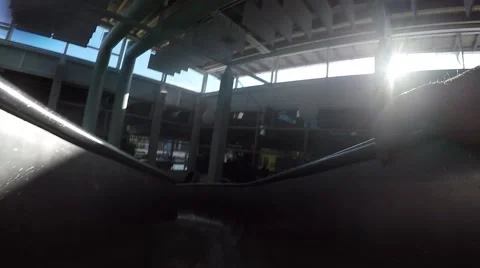 Man sliding down a water slide in swimming pool Stock Footage 55474441