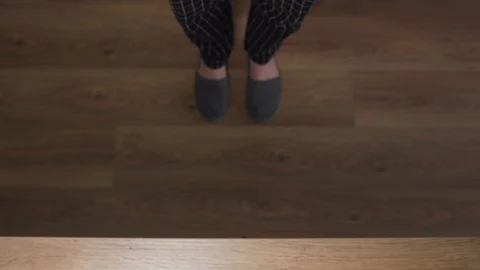 Man in slippers opens a kitchen drawer with metal cutlery Stock Footage 121314453