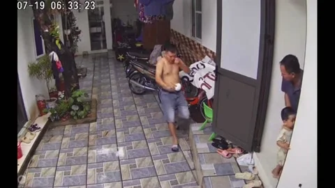 Man Slips Avoiding Headbutt on A Sharp Angle in Xuan Hoa, Vietnam Stock Footage 247502071