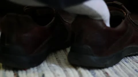 Man Slips on Shoes Stock Footage 10807204