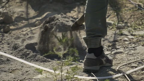 Man in slow motion digging with a shovel Видео 247280740