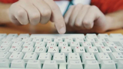 The man slowly typing on a computer keyboard Stock Footage 70170530
