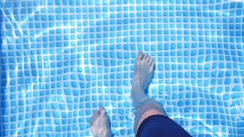 Man slowly walks into the pool Stock-Footage 131314102