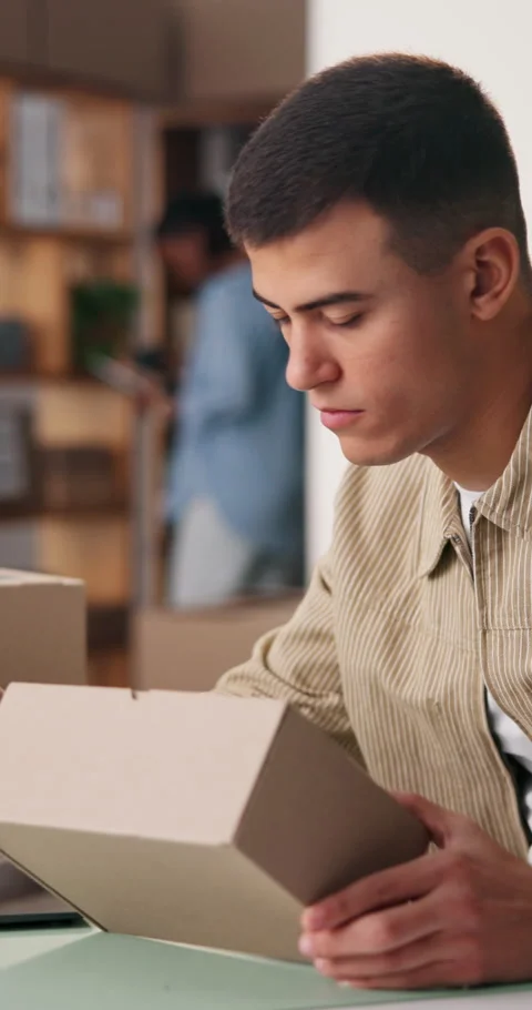 Man, small business and box with laptop in office for logistics, supply chain Stock Footage 334315408