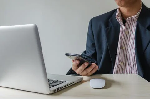 Man smart phone and computer Stock Photos