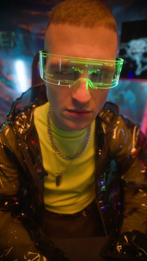 Man in Smart Visor Typing on Keyboard of Computer while Hacking in Neon Office Stock Footage 327638704