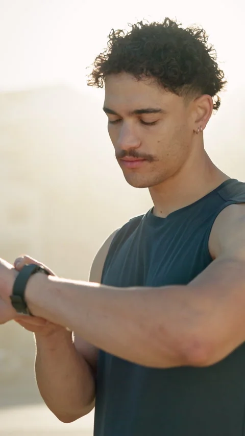 Man, smart watch and runner in city, exercise and click with timer, monitor and Stock Footage 327362444