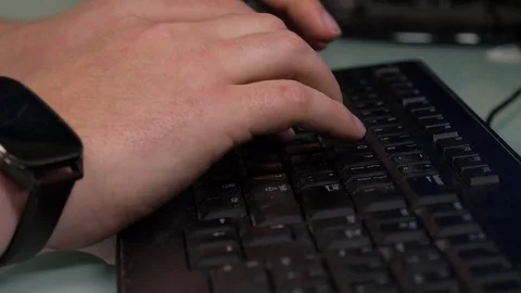 Man with smart watch typing and using mouse Stock Footage 76586397