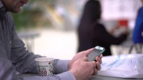 A man with a smartphone. Close-up of the hand at the break. Stock Footage 75447285