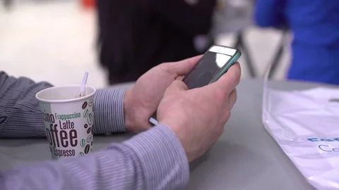 A man with a smartphone. Close-up of the hand at the break. Stock Footage 75447373