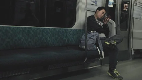 Man With Smartphone In Commuter Train Stock Footage 106472772