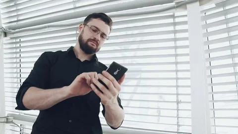 Man with smartphone Stock Footage 73468375