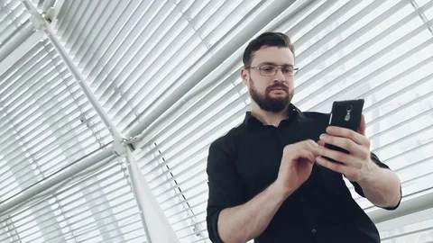 Man with smartphone 스톡 동영상 73468458