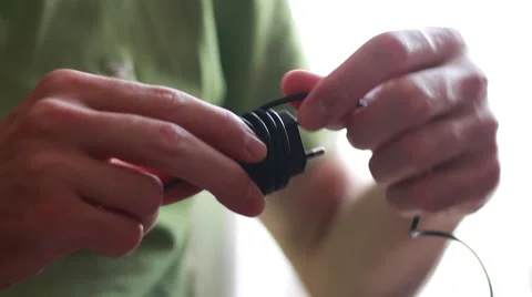 Man with smartphone power adapter 動画素材 64621386