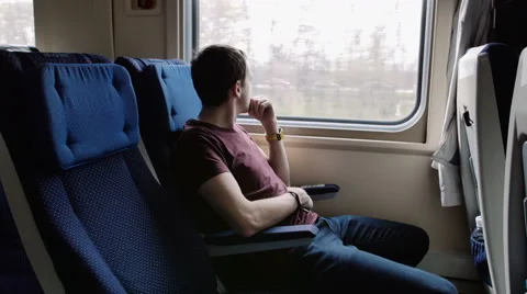 Man with smartphone riding train Stock Footage 62682099