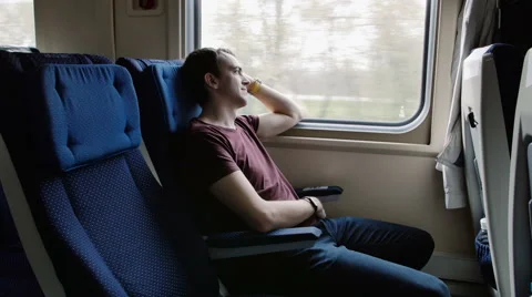 Man with smartphone riding train Stock Footage 62682623