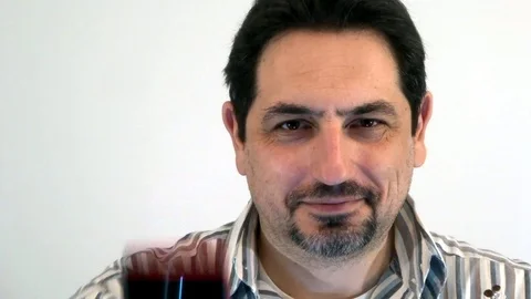 A man with a smartphone is smiling Stock Footage 93098333