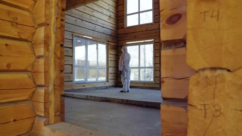 Man smartphone talking, protective suit, house window General plan coronavirus Stock Footage 130211226
